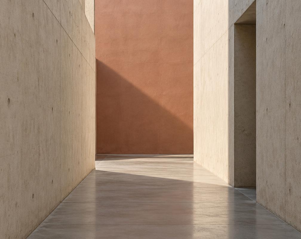 Contemporary architectural passage with a muted terracotta wall